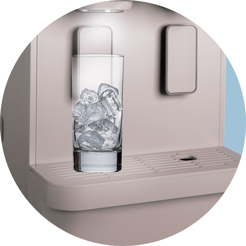 A glass of ice resting on the wider water tray of the Coway Lucy Plus
