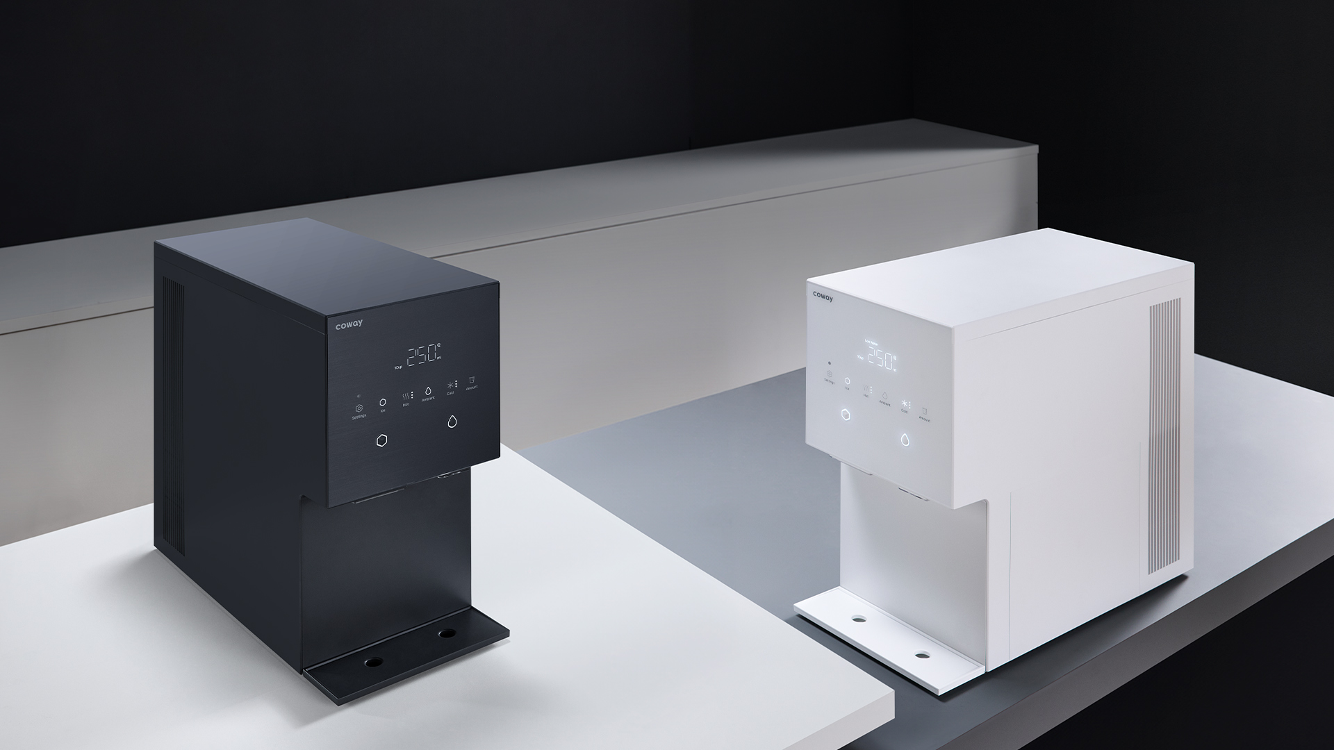 Coway Ais in Pebble Gray and Porcelain White shown side by side on a counter