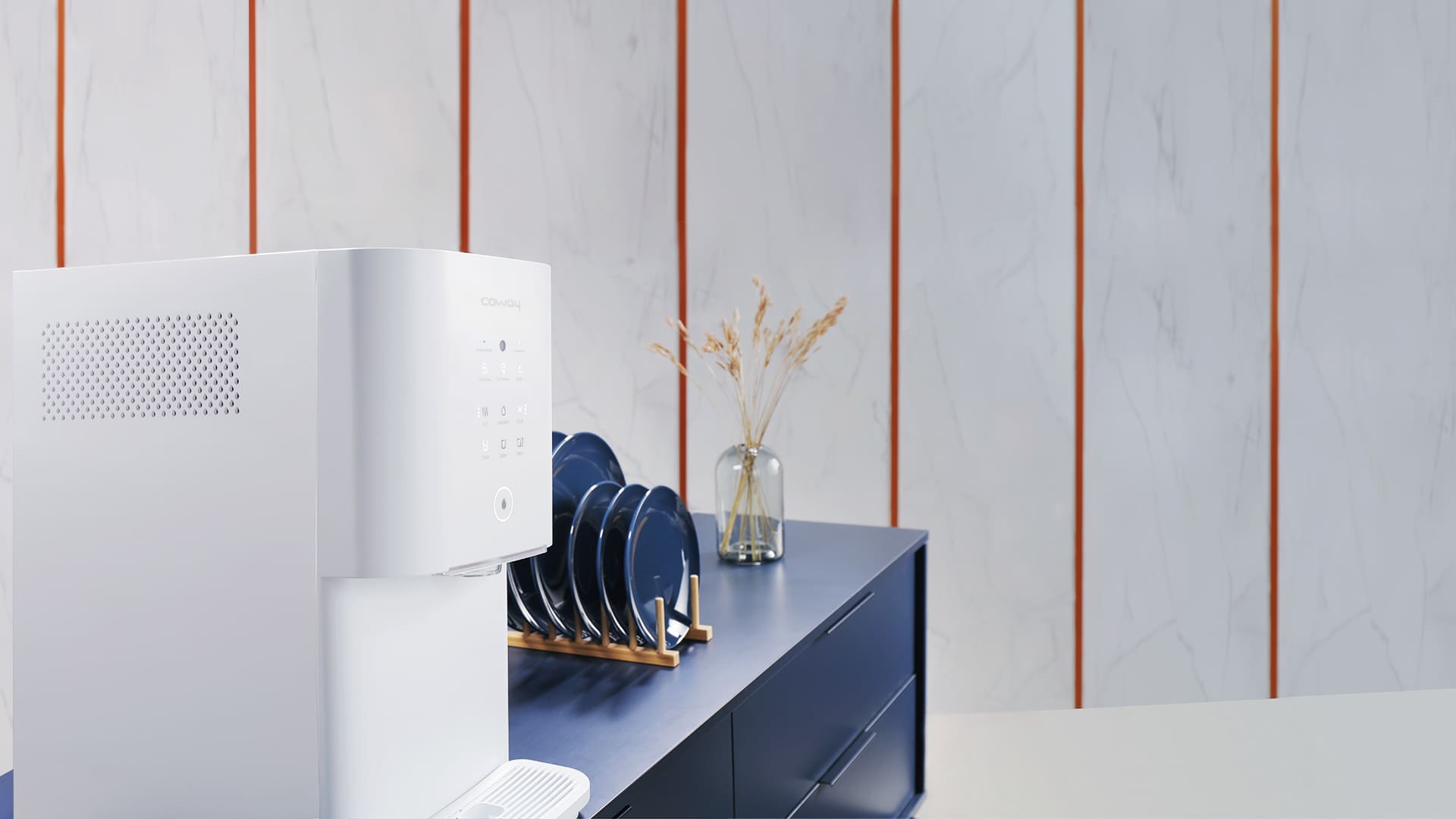 Coway Glaze beside a navy cabinet with plates and a vase, showing its clean design